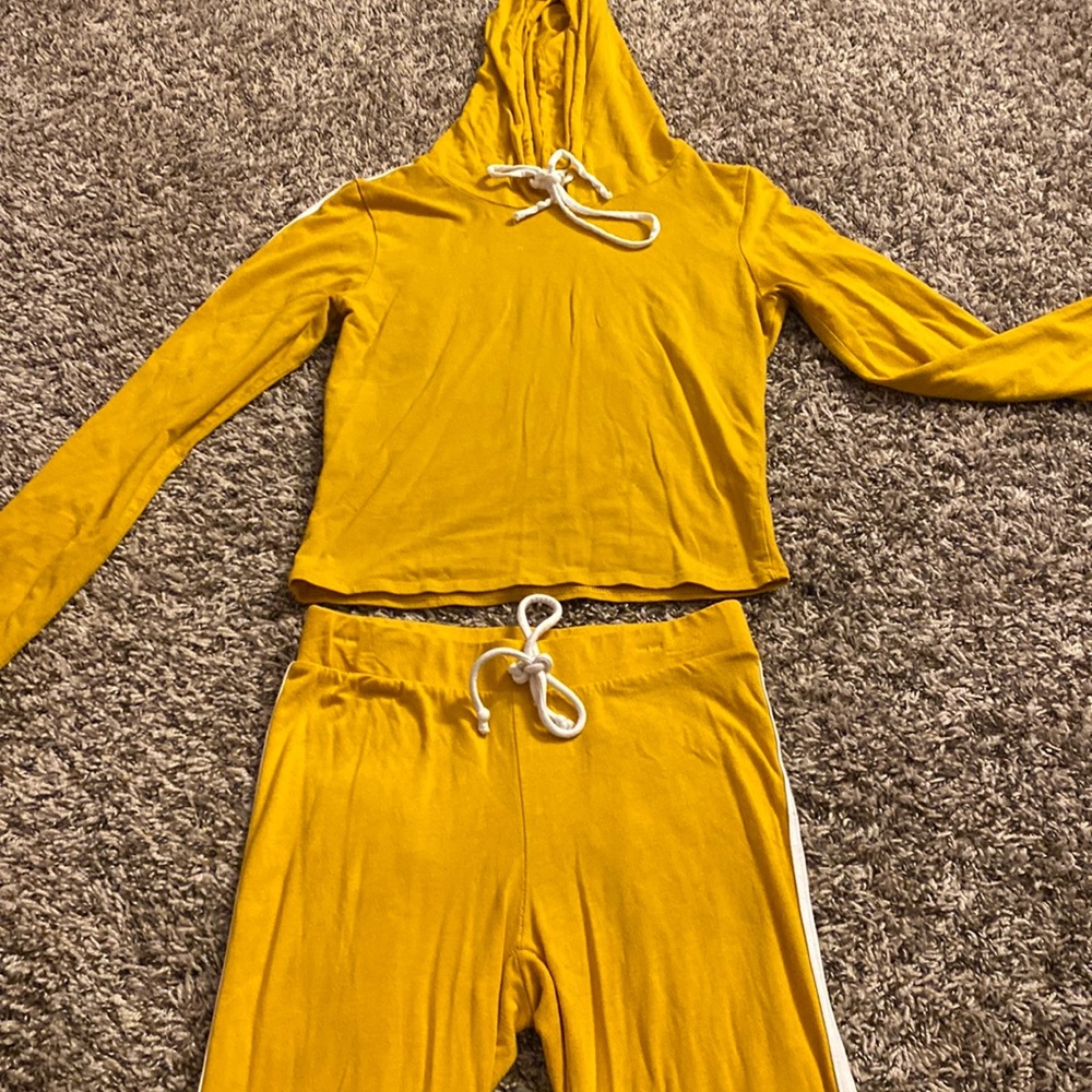I am selling a long sleeve two piece, size small from rainbow, mustard yellow